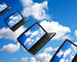 notebook computers flying through clouds