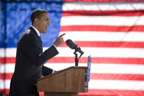 Obama in front of a large US flag