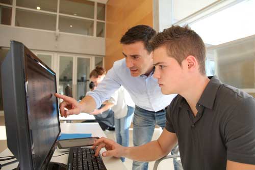 Two Men at Computer Terminal